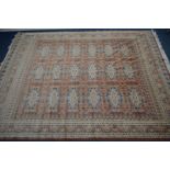 A HAND KNOTTED JALDAR CARPET SQUARE, with russet ground, 337cm x 258cm