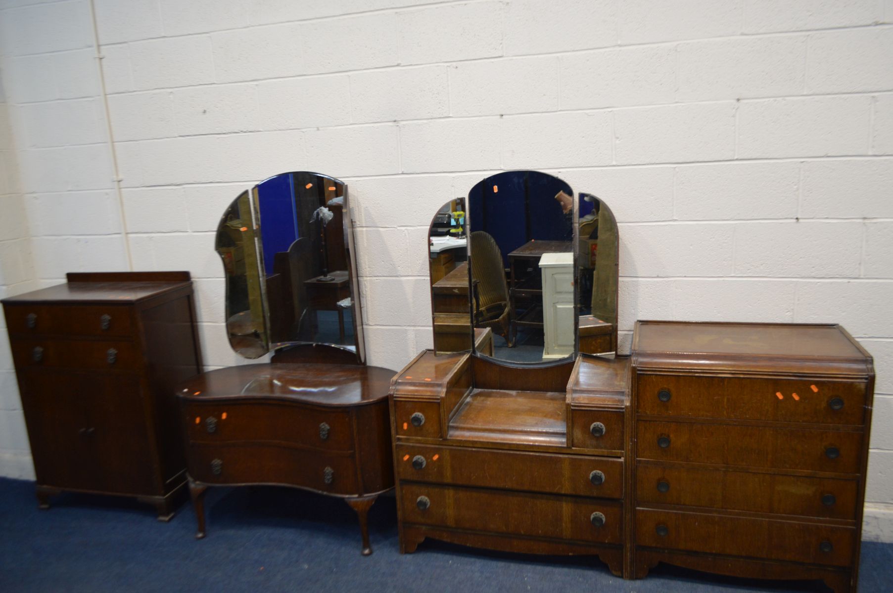 TWO 1930'S/40'S OAK TWO PIECE BEDROOM SUITES, comprising a dressing table and tallboys/chest of