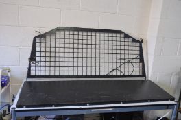 A TWO PART DOG GUARD / BULKHEAD FOR A LAND ROVER DISCOVERY, bottom section is 144cm wide x 46cm