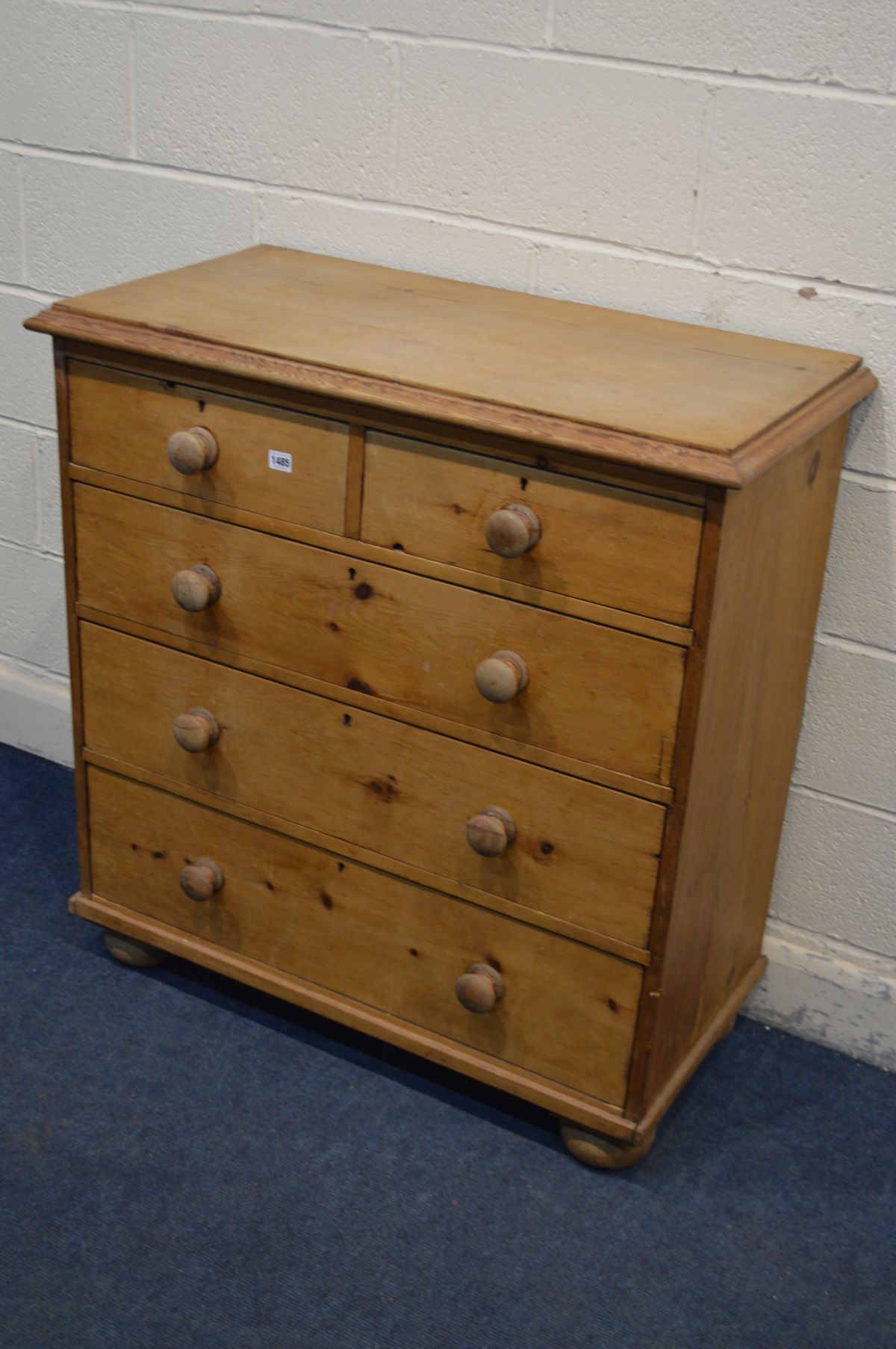 A VICTORIAN PINE CHEST OF TWO SHORT OVER THREE LONG DRAWERS, turned handles, on flat bun feet, width