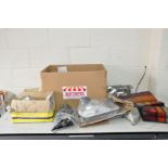 A BOX CONTAINING VINTAGE CAR PARTS including three 1994-2000 Transit Mk3 head lamps, a Cortina Mk5