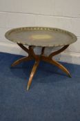 A MORROCAN BRASS TOPPED OCCASIONAL TABLE on a folding spider leg base, diameter 78cm x height 48cm