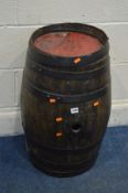 A COOPERED AND IRON BOUND BARREL, height 64cm