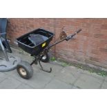 A LARGE GARDEN SEED SPREADER 80cm wide and 80cm high