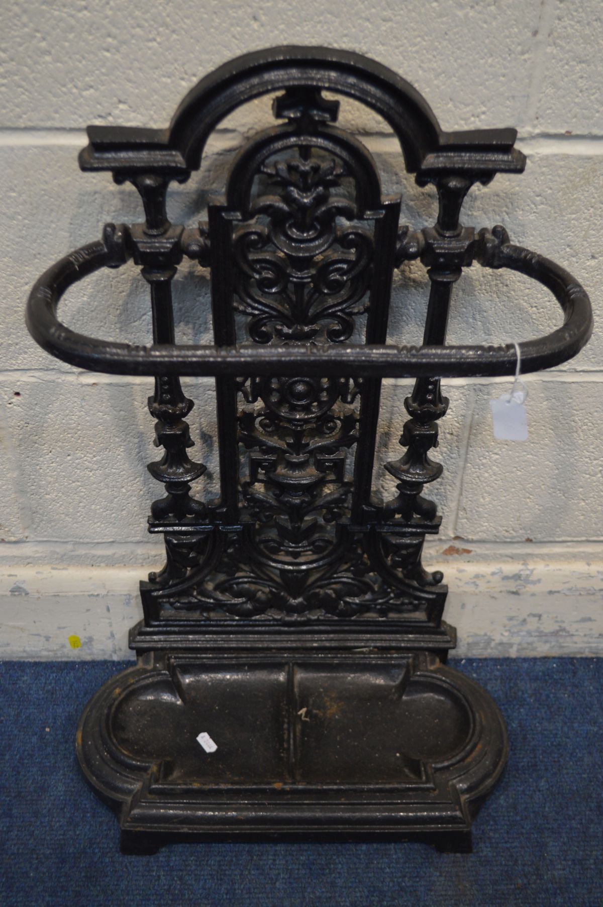 A CAST IRON UMBRELLA STAND, painted black, with a removable tray, height 70cm - Image 2 of 2