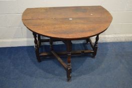 A GEORGIAN OAK GATE LEG TABLE, on turned legs, length 123cm x closed 52cm x height 72cm