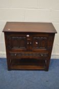 AN OAK TWO DOOR CABINET, above a single long drawer, and an undershelf, width 82cm x depth 41cm x