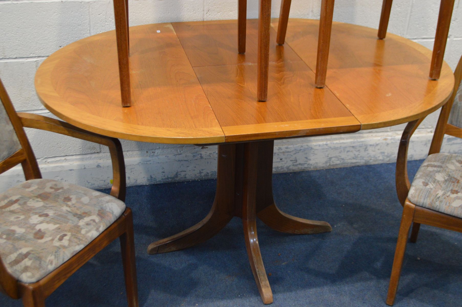 A NATHAN TEAK CIRCULAR EXTENDING DINING TABLE, with one additional fold out leaf, extended length - Image 3 of 3