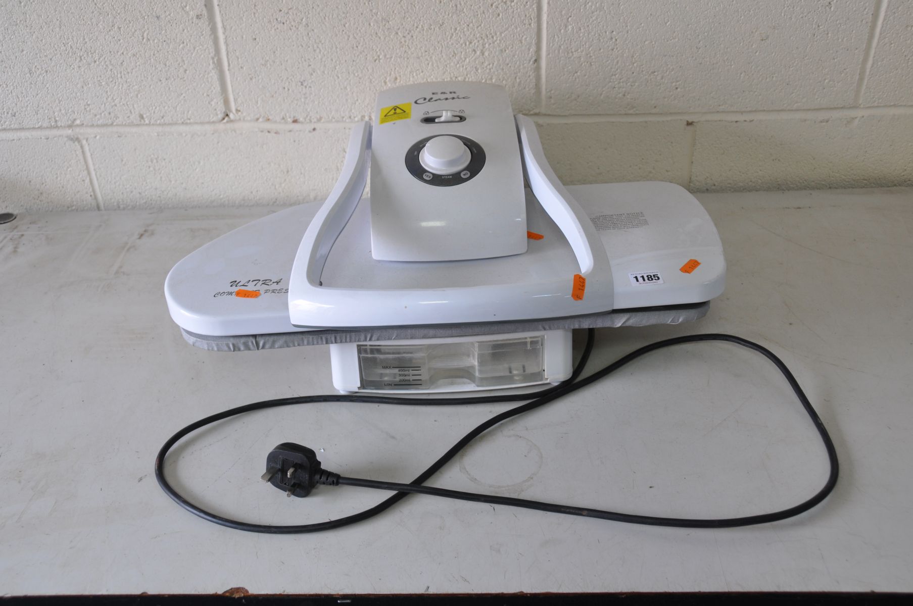 A E&R CLASSIC ULTRA COMPACT LAUNDRY PRESS (PAT pass and working) and a folding metal stool