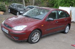 A 2003 FORD FOCUS LX TDCi HATCHBACK CAR in red, V5C present first Registered 31/03/2003 under Number