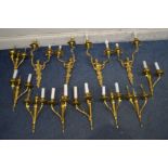 A SET OF FOUR CHERUB BRASS TWIN BRANCH WALL LIGHTS, along with a set of eight gilt on metal twin