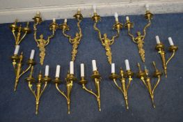 A SET OF FOUR CHERUB BRASS TWIN BRANCH WALL LIGHTS, along with a set of eight gilt on metal twin