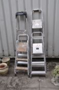 FOUR ALUMINIUM STEP LADDERS the largest being 167cm high