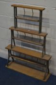A VINTAGE BEECH AND METAL THREE TIER PAPER DISPENCER, width 78cm x height 108cm