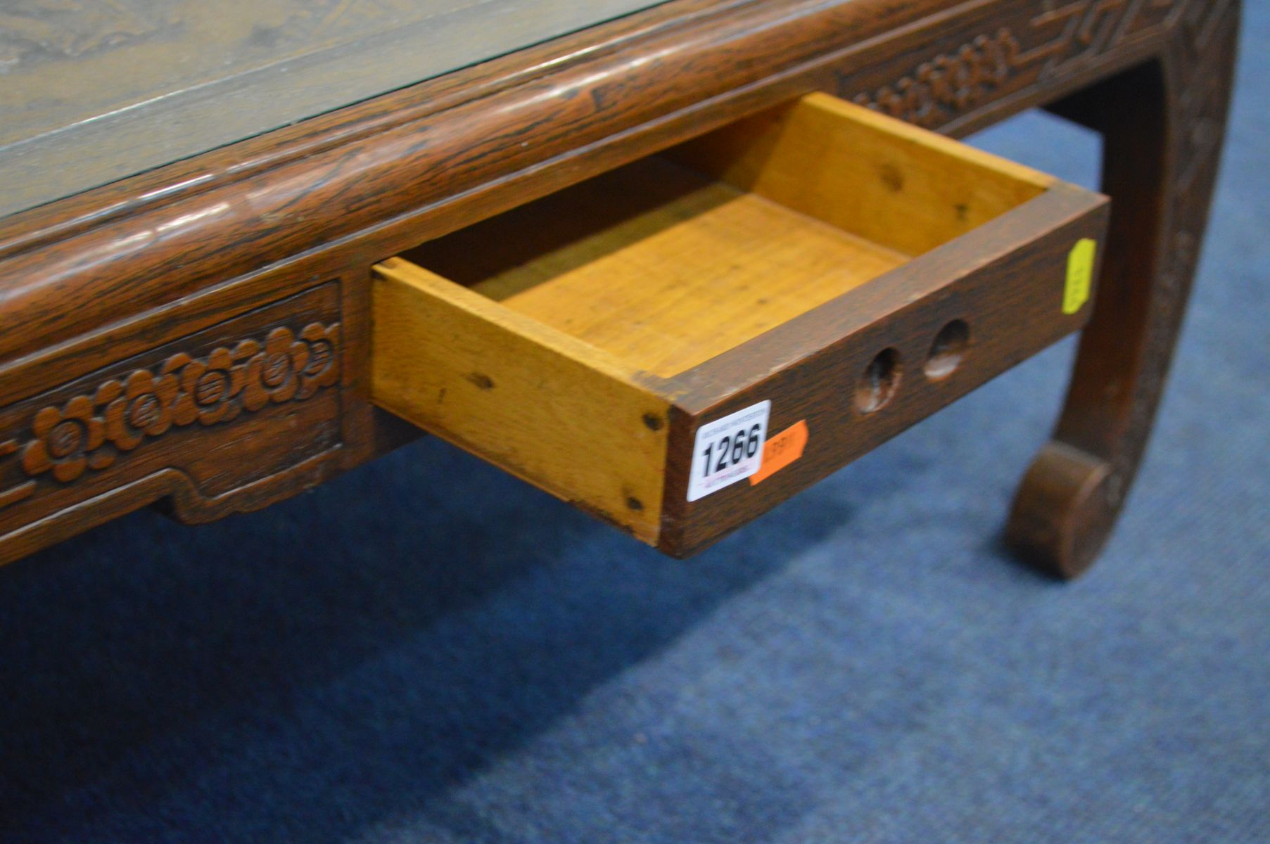 AN ORIENTAL HEAVILY CARVED CAMPHOR WOOD COFFEE TABLE, with glass insert, small frieze drawer on - Image 3 of 5