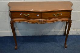 A REPRODUCTION BRIDGECRAFT MAHOGANY AND CROSSBANDED SERPENTINE SIDE TABLE, with two frieze