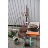 A RANSOMES PUSH ALONG LAWN MOWER, a Fire Basket, a wheel Barrow and various garden tools including
