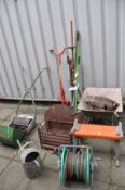 A RANSOMES PUSH ALONG LAWN MOWER, a Fire Basket, a wheel Barrow and various garden tools including