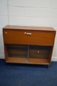 A MID 20TH CENTURY TEAK BOOKCASE/COCKTAIL CABINET, width 121cm x depth 37cm x height 108cm (key)