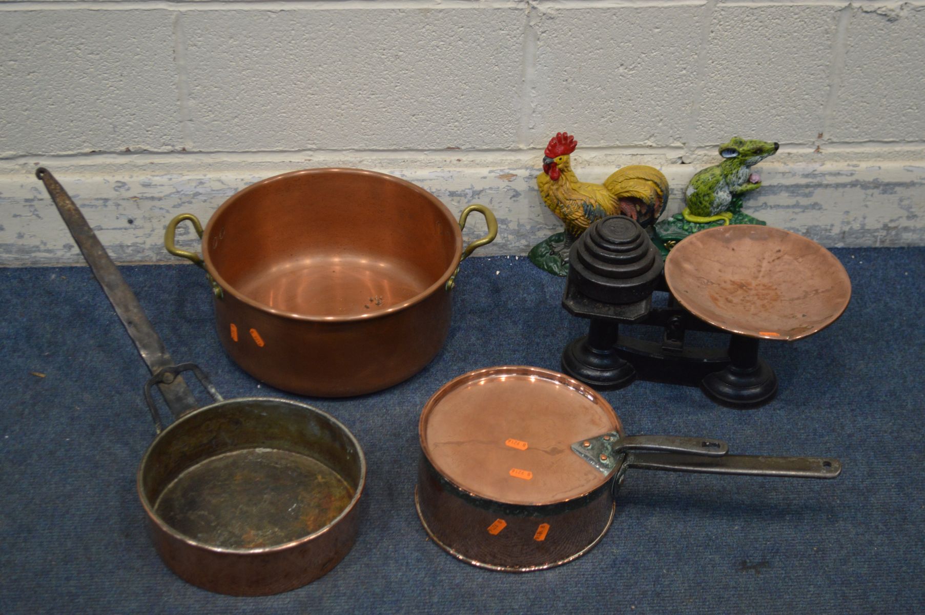 A COLLECTION OF COPPERWARE to include a jam pan with twin brass handles, a balance scale with