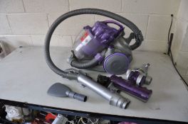 A DYSON DC08 TELESCOPE WRAP VACUUM CLEANER with various attachments (PAT pass and working)