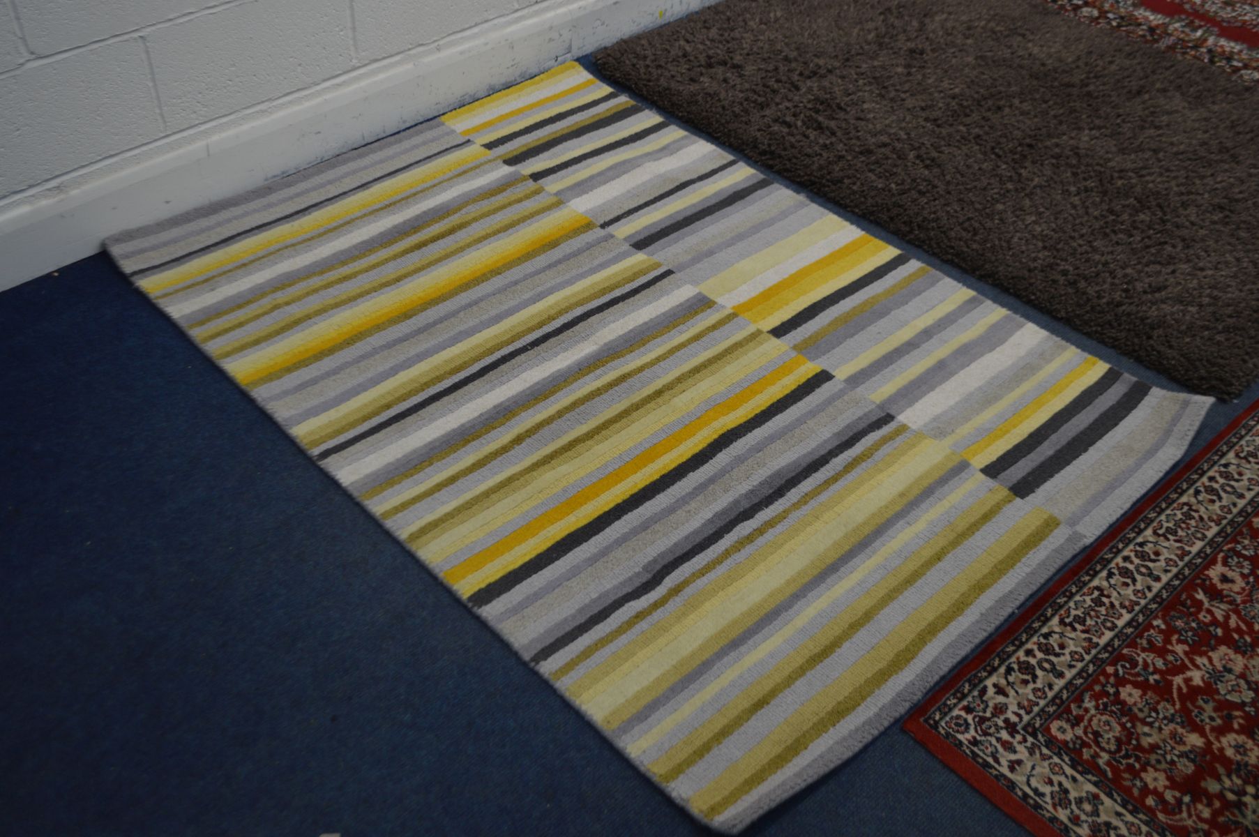 TWO MODERN RUGS, to include one stripped, largest size 170cm x 126cm and a red floral rug and a pair - Image 3 of 5