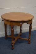 A REPRODUCTION VICTORIAN STYLE CIRCULAR OCCASIONAL TABLE, on four octagonal tapering supports,