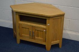 A LIGHT OAK CORNER TV STAND with double cupboard doors, width 94cm x depth 50cm x height 63cm