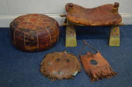 A CAMEL STOOL with a leather saddle, a patchwork leather pouffe, a leather cushion and bag (4)