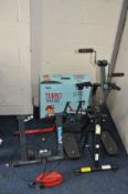A BOXED BIKE HUT TURBO TRAINER for clamping your existing bike to the stand which has adjustable