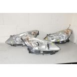 THREE VAUXHALL CORSA HEADLAMP ASSEMBLIES comprising of a NS and OS for a 2006-2011 Deisel and a NS