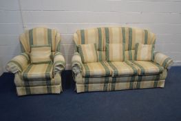 A WADE REGENCY STRIPPED UPHOLSTERED THREE SEATER SETTEE and an armchair (2)