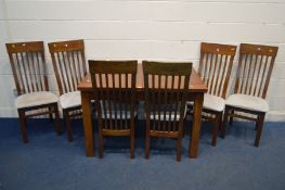 A MODERN OAK EXTENDING DINING TABLE, with a single leaf (leaf does not come out from under table