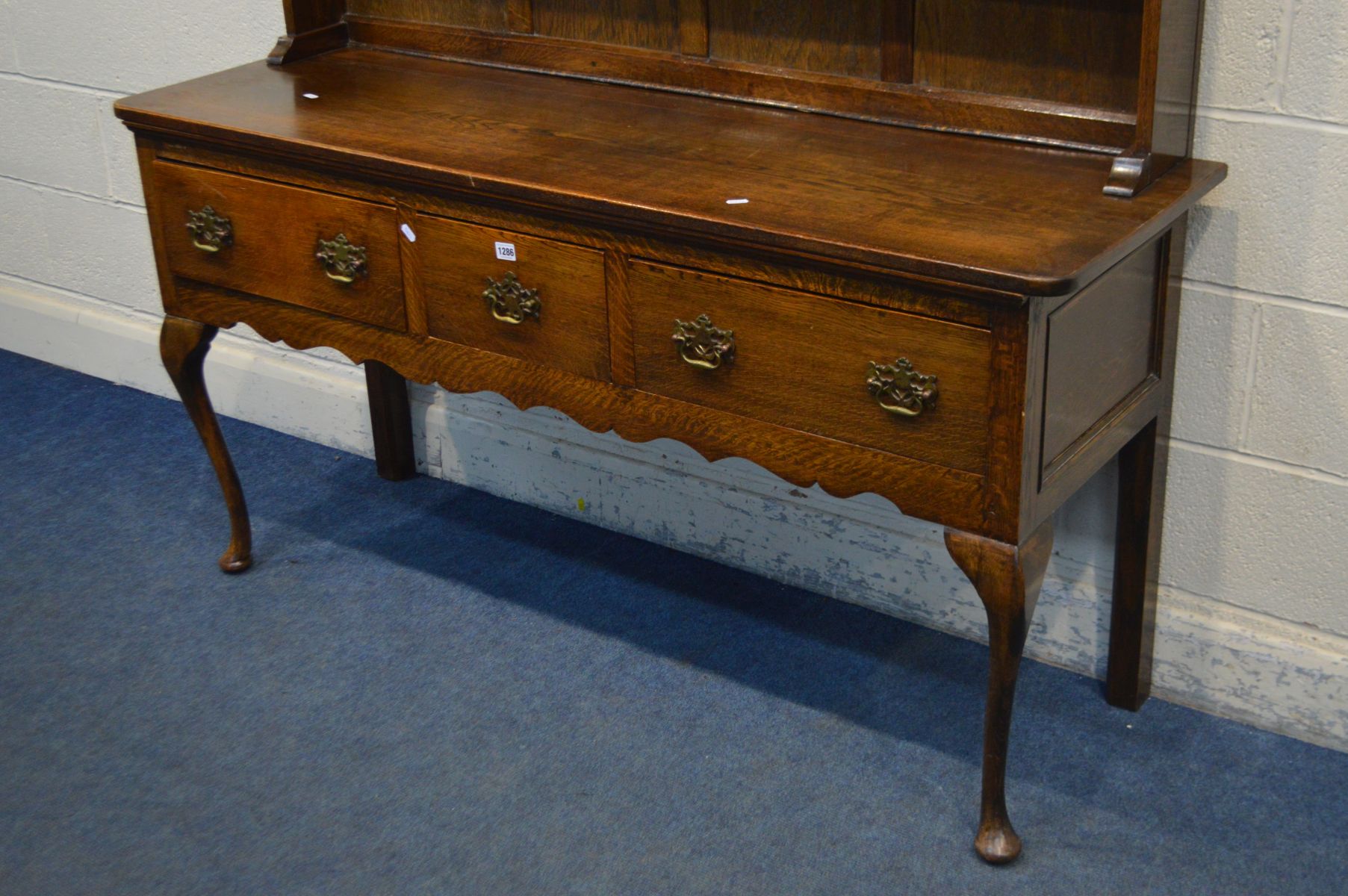 A GEORGE III STYLE OAK DRESSER, the top with a wavy apron to the top, twin single doors, over a base - Image 3 of 3