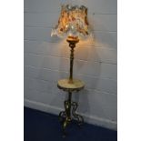 AN EARLY 20TH CENTURY BRASS AND ONYX STANDARD LAMP, with a triple light fitting from converted