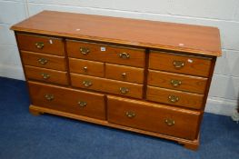 A YOUNGER CHERRYWOOD SIDEBOARD/CHEST OF NINE ASSORTED DRAWERS, width 146cm x depth 46cm x height