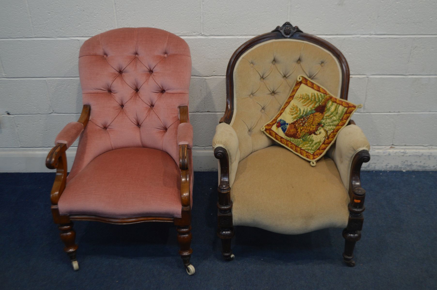 A VICTORIAN WALNUT UPHOLSTERED BUTTON BACK ARMCHAIR, with scrolled arm rest, on turned legs and