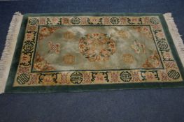 A CHINESE WOOLLEN GREEN RUG, 164cm x 94cm