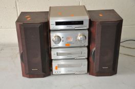 A TECHNICS SE-HD560 with Tuner, CD player, Tape Player, Amplifier and a Pair of matching speakers (