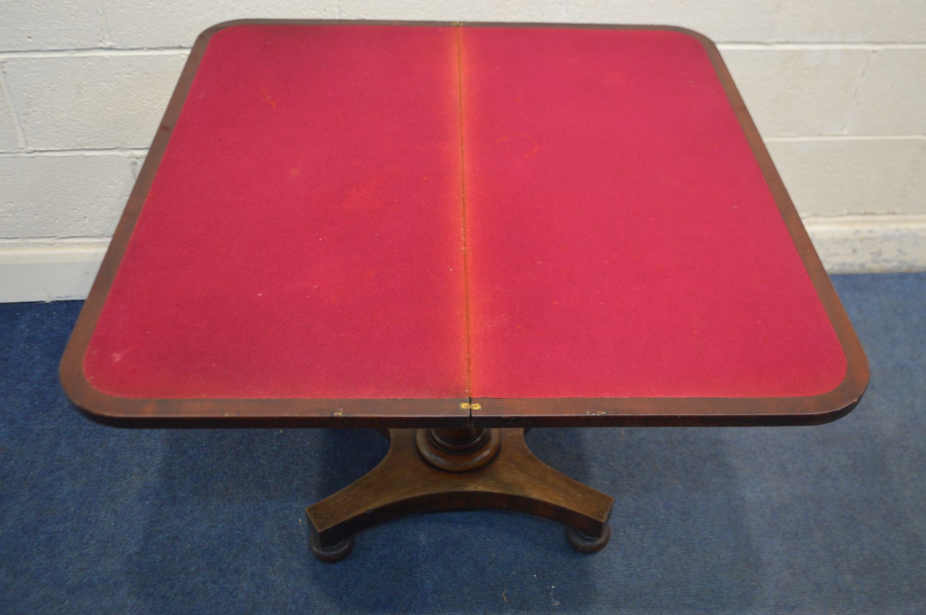 A VICTORIAN MAHOGANY CARD TABLE, the fold over top enclosing a green baize lining, on a single - Image 2 of 3