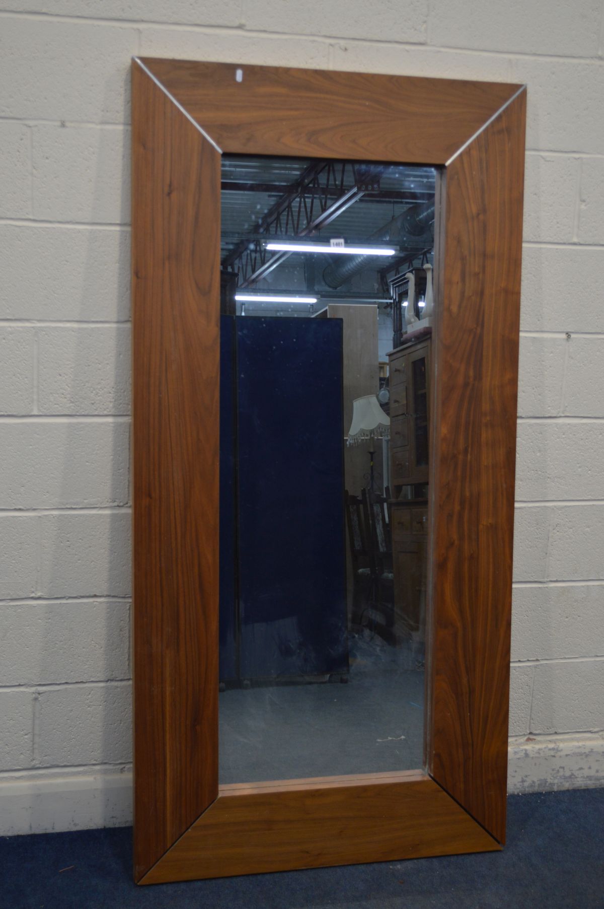 A MODERN HARDWOOD FINISH FLOORSTANDING MIRROR (Sd and missing two chrome pieces to corner)