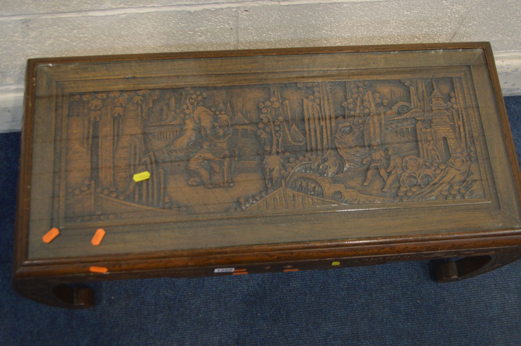 AN ORIENTAL HEAVILY CARVED CAMPHOR WOOD COFFEE TABLE, with glass insert, small frieze drawer on - Image 2 of 5