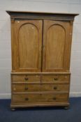 A VICTORIAN SATIN BIRCH VENEERED TWO DOOR LINEN PRESS, with four slides, over two short and two long