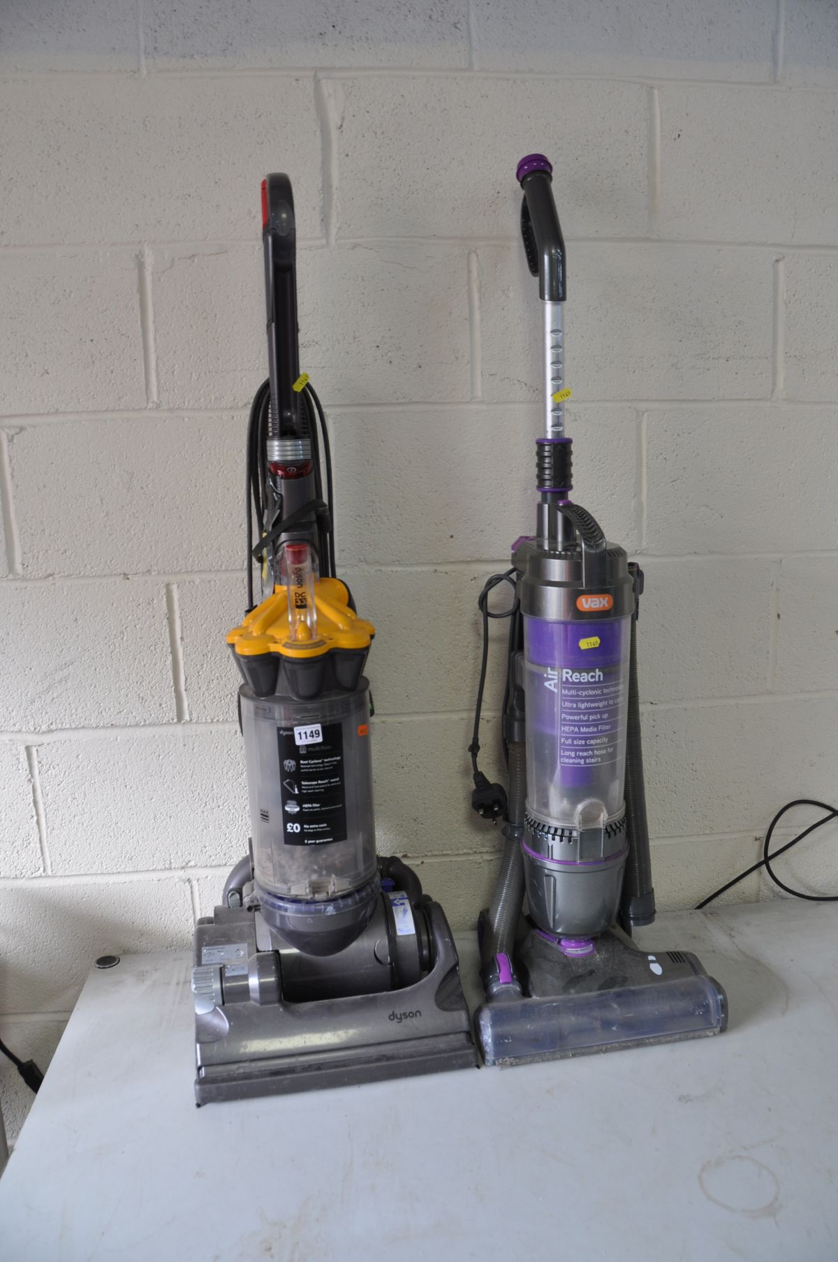 A DYSON DC33 VACUUM CLEANER with two spare belts and a Vax Air Reach Vacuum cleaner (both PAT pass
