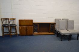 A 1930'S WALNUT COCKTAIL CABINET (veneer lifting and loss) an oak fire surround cabinet, width 142cm