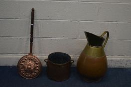 A LARGE BRASS AND COPPER FRENCH JUG, along with a copper planter and a warming pan (3)