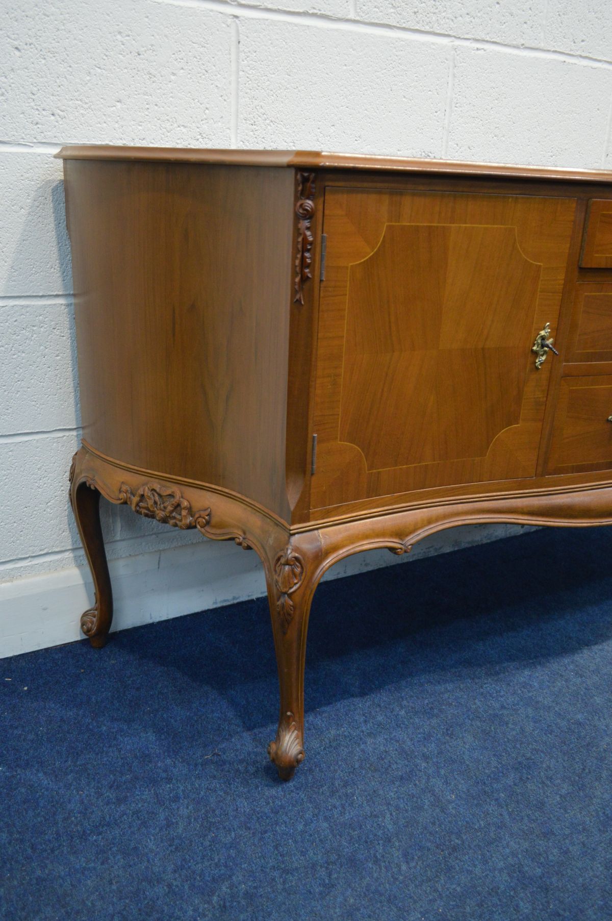 A REPRODUCTION BRIDGECRAFT MAHOGANY AND CROSSBANDED SERPENTINE SIDEBOARD, with two cupboard doors - Image 3 of 3