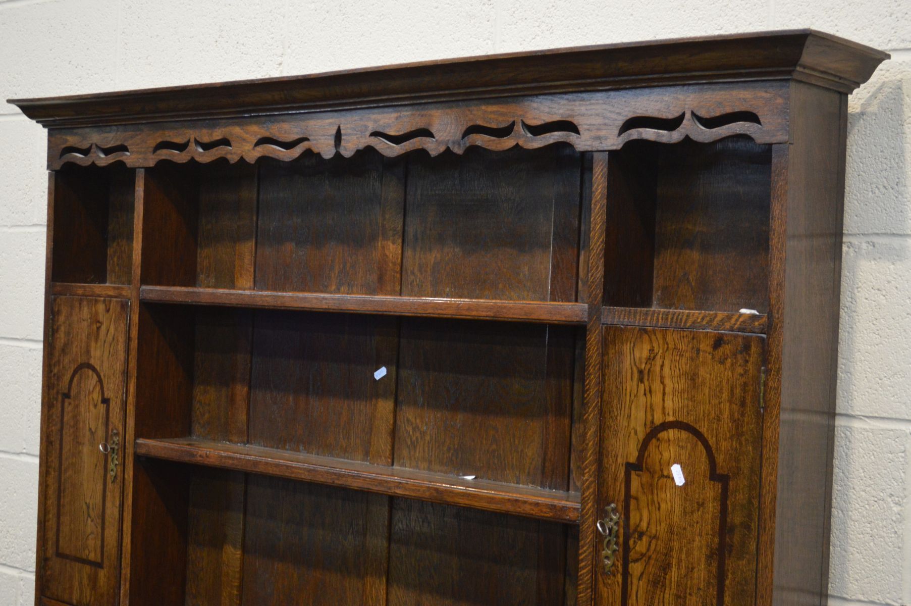 A GEORGE III STYLE OAK DRESSER, the top with a wavy apron to the top, twin single doors, over a base - Image 2 of 3