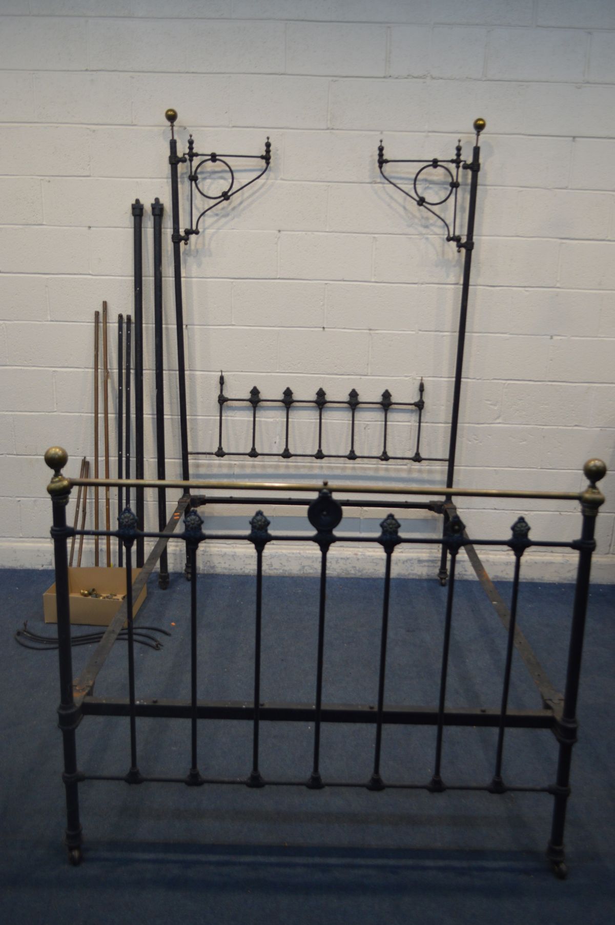 A DISTRESSED VICTORIAN 4FT6 CAST IRON HALF POSTER BED (unknown if complete)