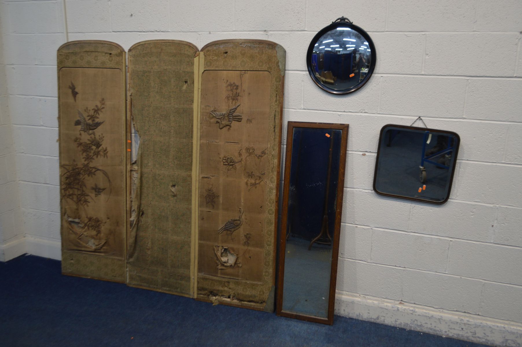 A DISTRESSED FABRIC THREE FOLD FLOORSTANDING SCREEN, along with an oak rectangular wall mirror, a